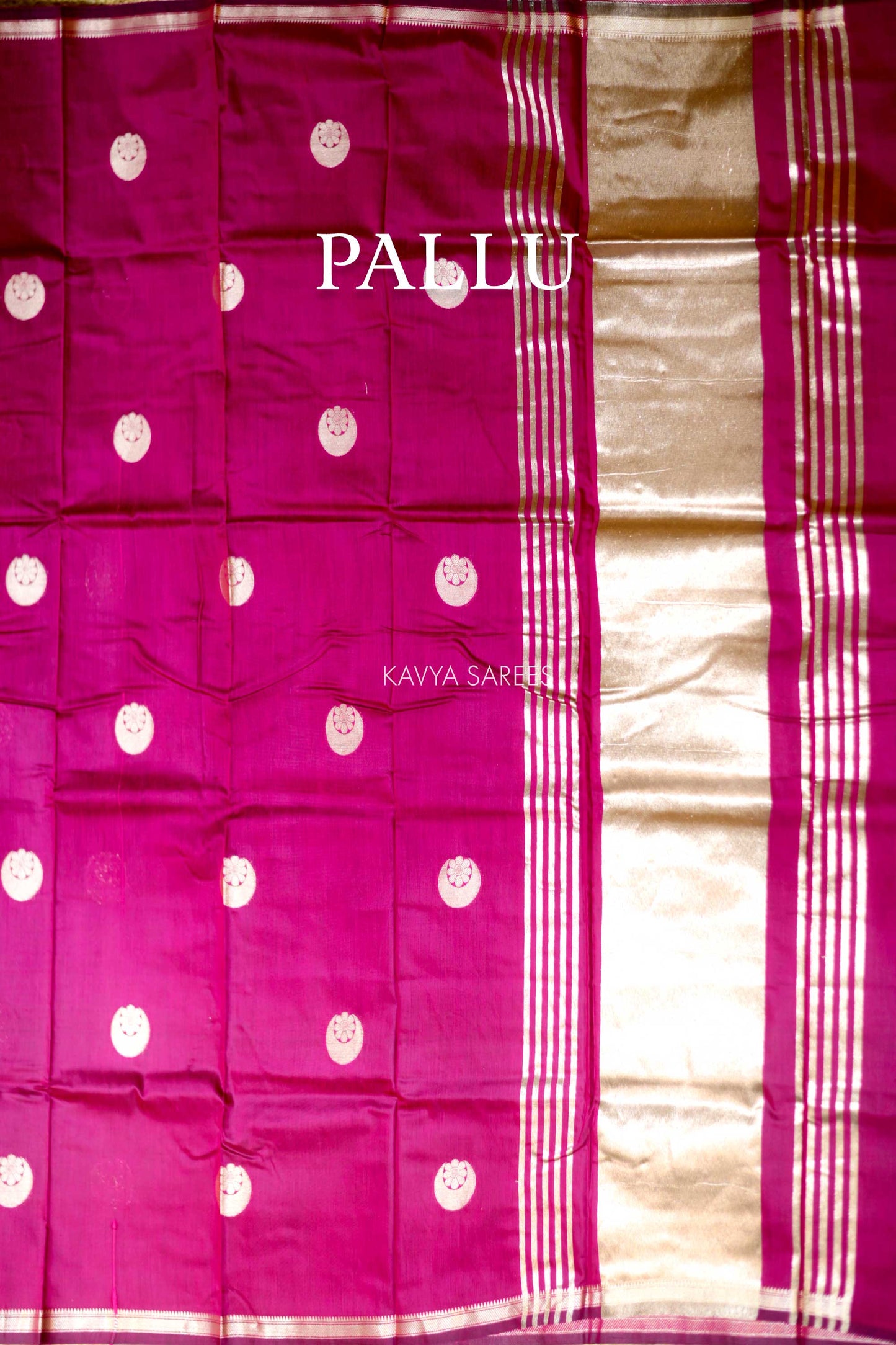 Graceful rani pink Chanderi saree featuring subtle silver buttas and classic zari detailing