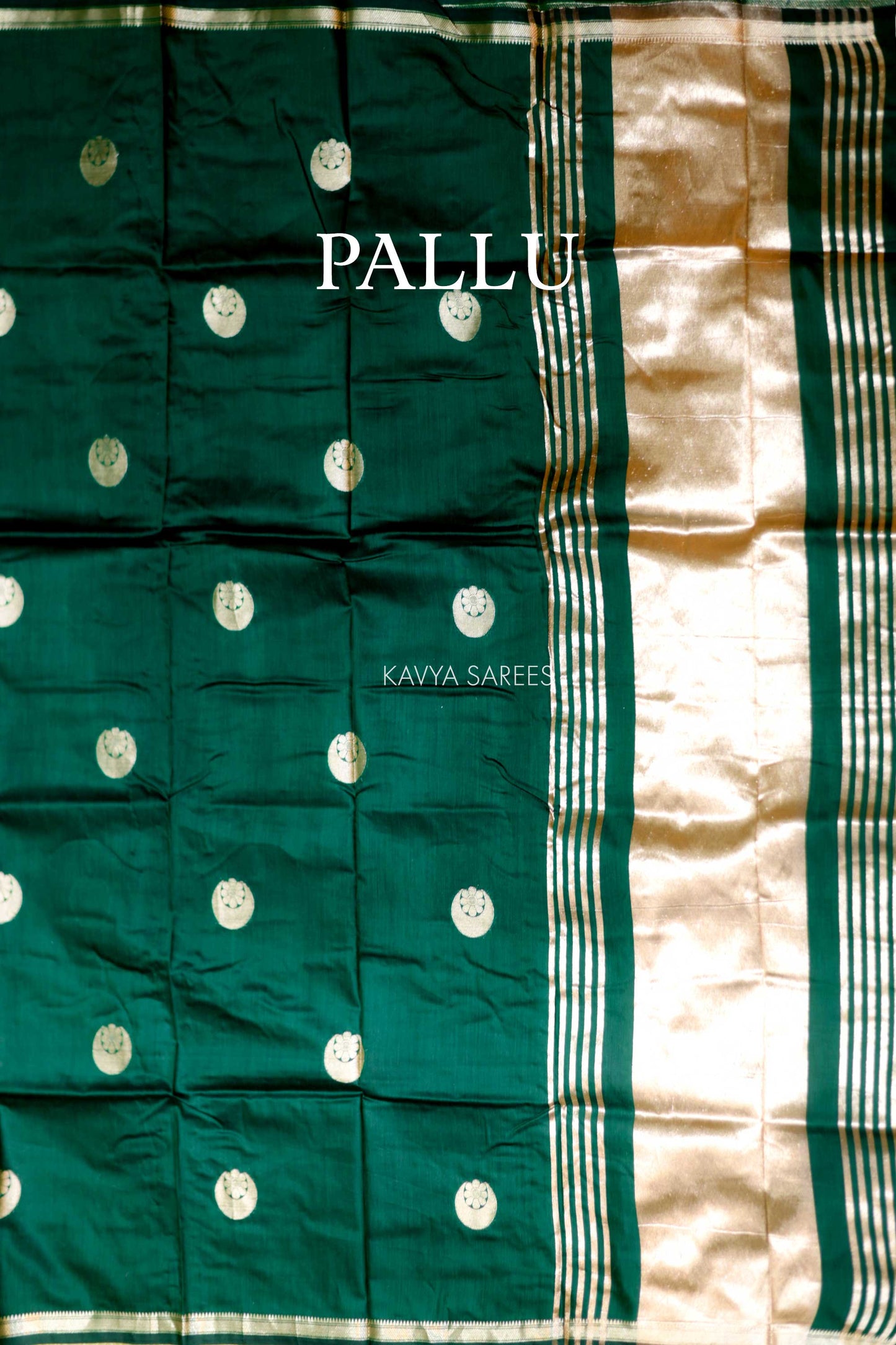 Elegant emerald green Chanderi saree with silver zari motifs and rich festive appeal