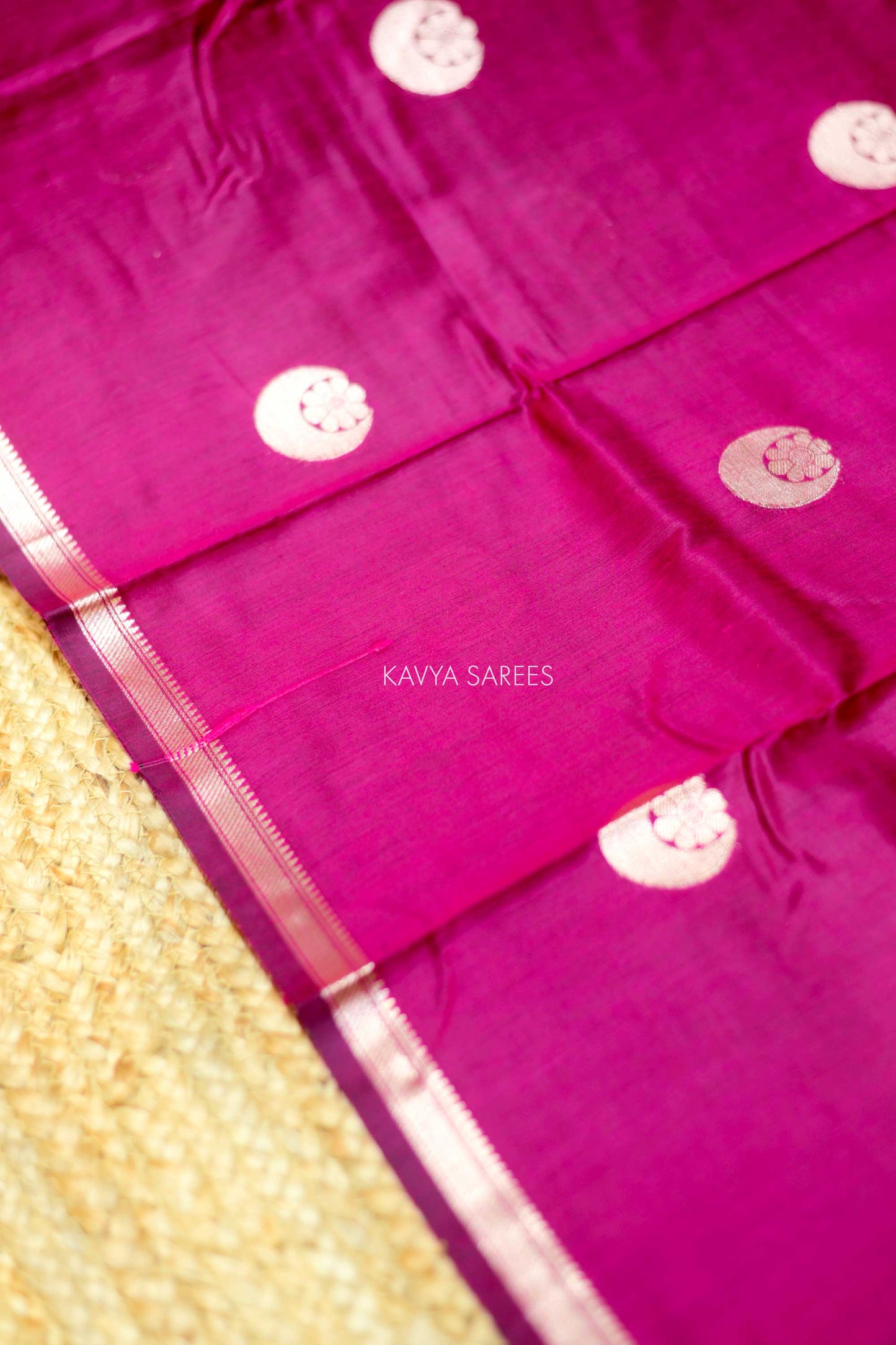 Graceful rani pink Chanderi saree featuring subtle silver buttas and classic zari detailing