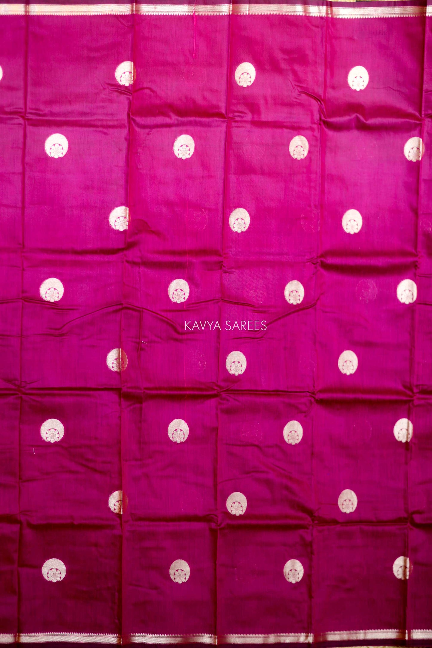 Graceful rani pink Chanderi saree featuring subtle silver buttas and classic zari detailing