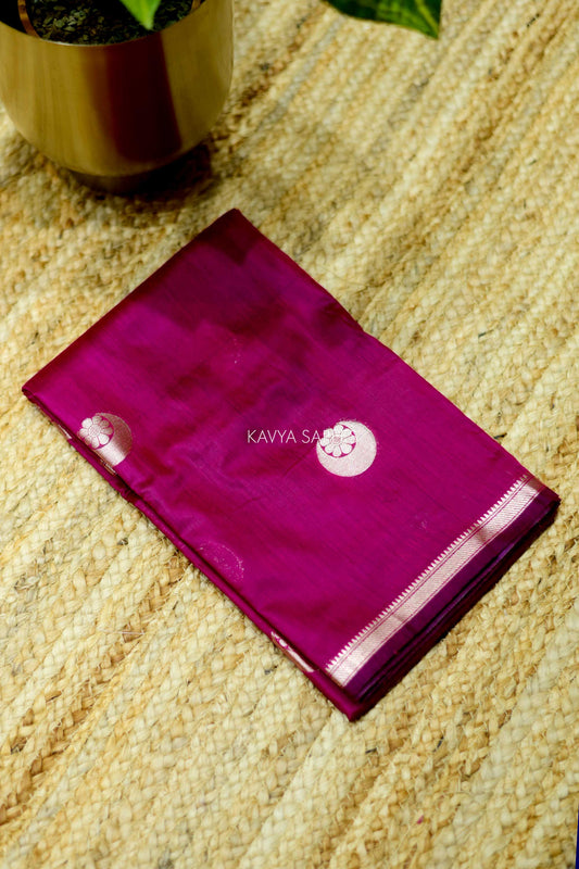 Graceful rani pink Chanderi saree featuring subtle silver buttas and classic zari detailing