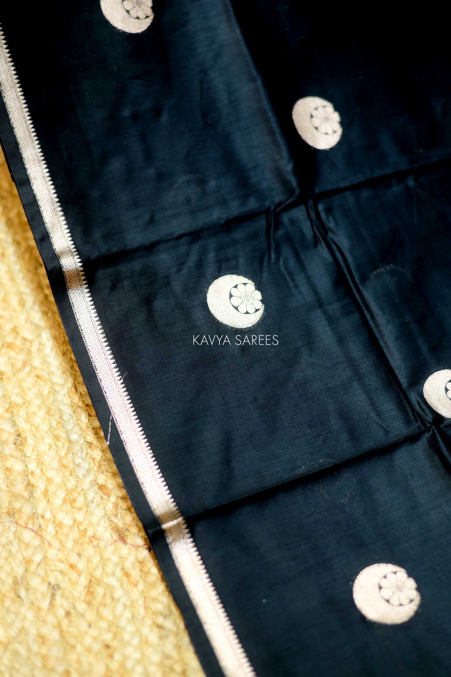 Stylish black Chanderi saree with striking silver buttas and minimal elegant border
