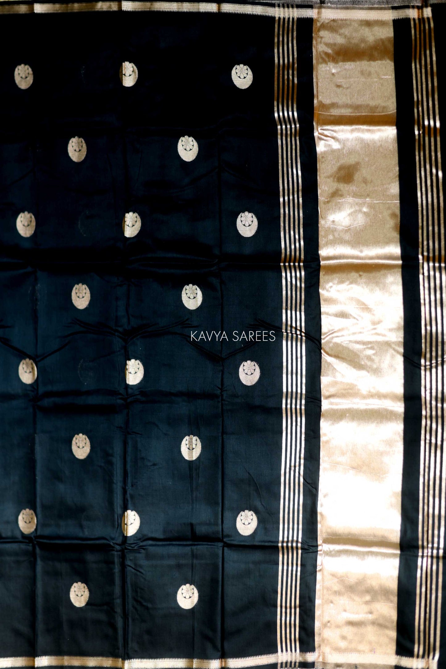 Stylish black Chanderi saree with striking silver buttas and minimal elegant border