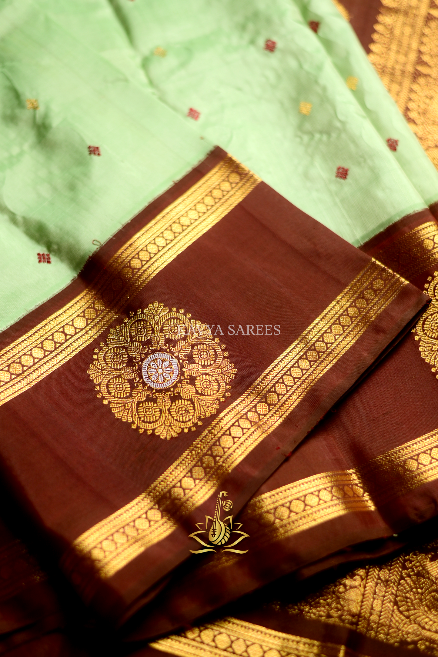 Mint Green Gadwal Pattu Saree with Rich Chocolate Brown Zari Border