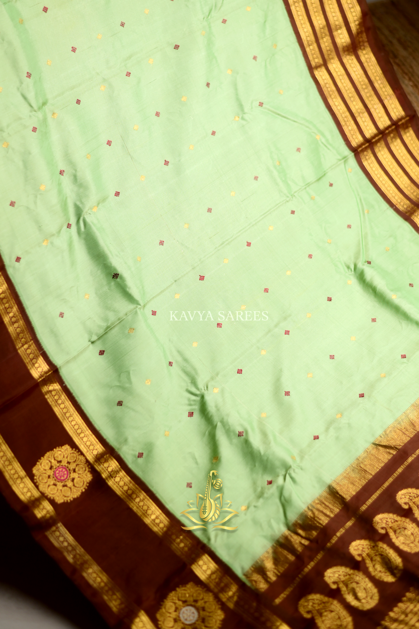 Mint Green Gadwal Pattu Saree with Rich Chocolate Brown Zari Border