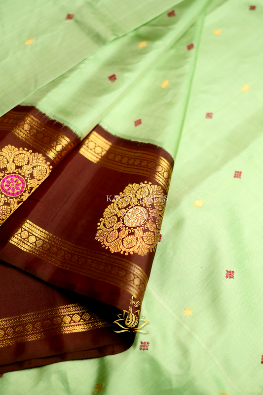 Mint Green Gadwal Pattu Saree with Rich Chocolate Brown Zari Border